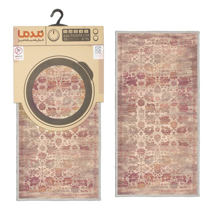 Alfombrilla vintage 'Rose' sobre un fondo blanco con el embalaje visible en el lado opuesto. El diseño con motivos florales y geométricos en tonos crema, rosas y rojos añade elegancia, y es lavable en lavadora.