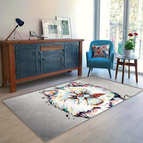 Alfombra 'Gatito' en una sala de estar moderna, donde su diseño alegre con un gato ilustrado en colores vivos se convierte en el centro de atención, aportando un aire de fantasía y alegría al espacio. Perfecta para entusiastas de los gatos que buscan un elemento decorativo único y cómodo. Lavable en lavadora, base antideslizante, sin pelusas.