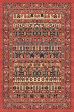 Alfombra 'Heritage' sobre fondo blanco, resaltando sus patrones intrincados y la vibrante combinación de colores rojos y naranjas. Ideal para quienes buscan añadir un toque de elegancia clásica y calidez a cualquier espacio del hogar.