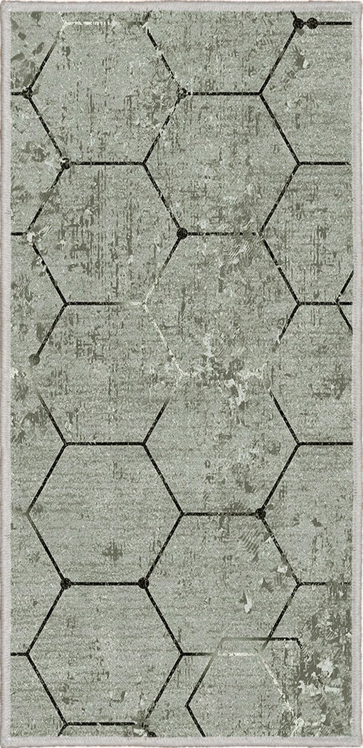 Alfombra 'Terra' sobre un fondo blanco, destacando su diseño hexagonal en tonos grises, ideal para añadir un toque de elegancia moderna y contemporánea a cualquier decoración.